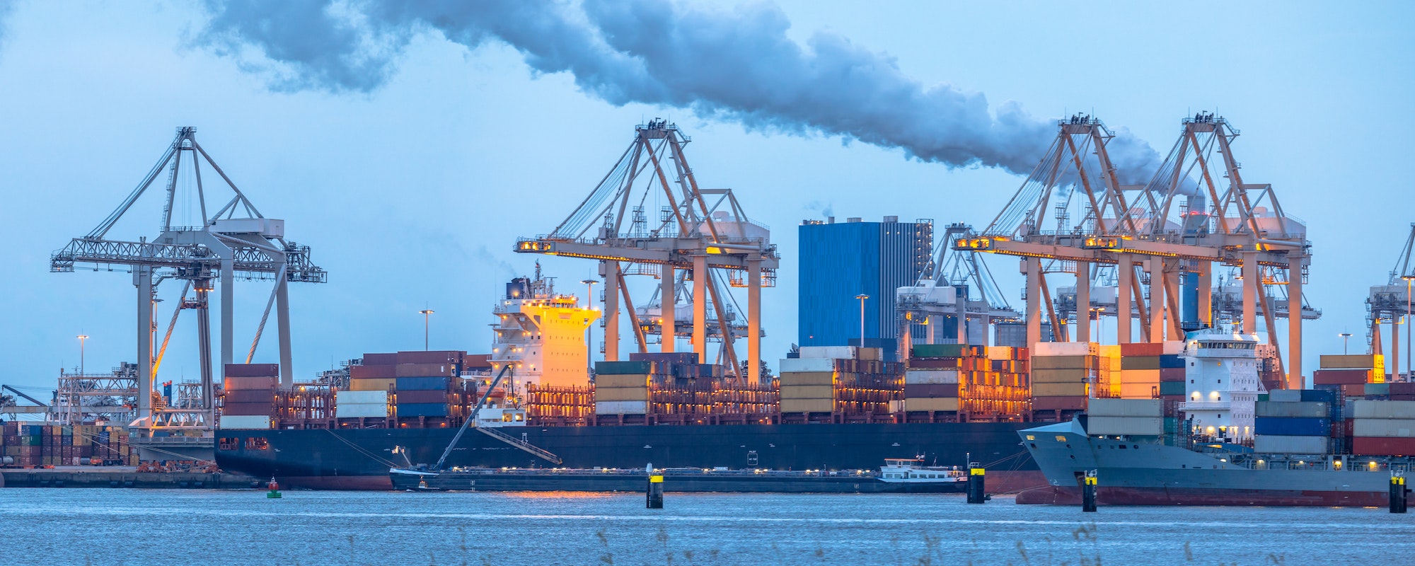 Container ships loading at Europoort tweede maasvlakte harbor